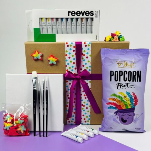 The Paint Me Colourful Gift Box is perfect for kids. The contents include a canvas, paint brushes, a 12 pack of acrylic paints, a bag of fruit popcorn and starfish lollies. Gift Hampers NZ. Gifts for You & Me. Gift packs for kids.