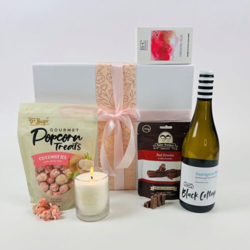 Relax Gift Basket. With a bottle of wine, a gorgeous candle, yummy popcorn, and a bag of chocolates. Gift hampers NZ. Gifts for You & Me