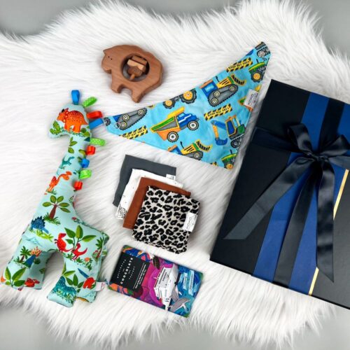 Precious Baby Boy Gift Box. Filled with NZ made products including a handmade soft toy giraffe, wash cloths, a bib, sheep rattle and a bar of Wellington Chocolate Factory chocolate. A gorgeous gift hamper for a baby boy. Gifts for You & Me