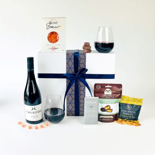 The Quality Time Gift Box. The contents of this gift hamper include a bottle of Two Rivers Pinot Noir, two stemless wine glasses, and some treats including Rose gummy bears, honey roasted peanuts, a bar of Bennetts of Mangawhai chocolate and a bag of Potter Brother's chocolates. All contained in a luxury gift box. A perfect gift for all occassions. Gift Boxes NZ. Gifts for You & Me.