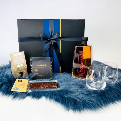 On the Rocks Gift Box. Great for whiskey lovers. With a bottle of Batch 10 manuka smoked whiskey, two whiskey glasses, a bag of luxury nuts, chocolate macadmias and deer sticks. Gift baskets for men. Gifts for You & Me