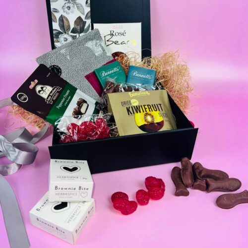 The Sweet Treats gift box, perfect for any sweet tooth. Included in the gift basket are rose gummy bears, 2x bars of Bennetts of Mangawhai chocolate, berry bark chocolate, a bag of Potter Brothers chocolates, 2x brownie bites, a bag of chocolate fish, a bag of raspberry drops and some little beauties. Gift baskets NZ. Gifts for You & Me.