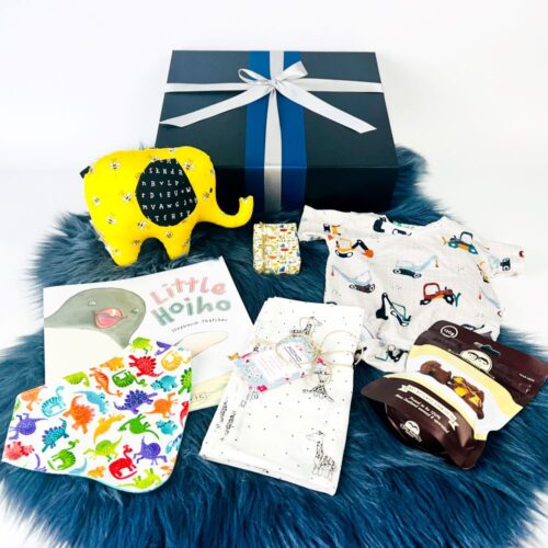 The Welcome Little Boy Gift Hamper - the perfect gift for baby boys. The gift box is fully NZ made including a handmade elephant soft toy, bib, wrap, little hoiho book, a gorgeous onesie and a bag of Potter Brothers chocolates. Gifts for You & Me