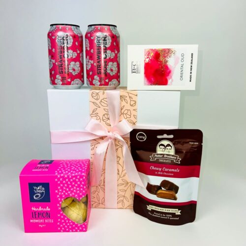 Perfectly Pink Gift Hamper - perfect gift box for her. Including two cans of strawberry cider, a bag of Potter Brothers chocolates, a box of cookies and a beautiful candle. Gifts for You & Me. Gifts for her.
