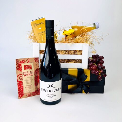 Spice Me Up Gift Basket. Containing everything needed for a beautiful mulled wine. A bottle of Two Rivers Pinot Noir, a mulled wine sachet, a bottle of orange juice and a bar of Bennetts of Mangawhai chocolate. All contained in a luxury gift box. Gifts for You & Me.