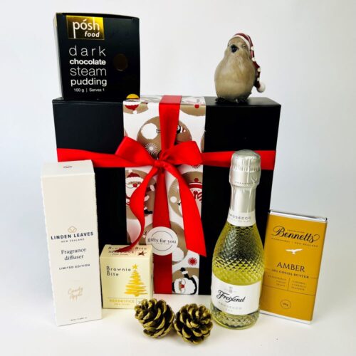 Christmas gift box containing a bottle of bubbles, a fragrance and Christmas treats. Gift boxes NZ. Christmas gift hampers.