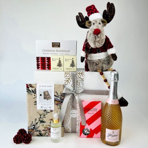 Christmas gift box containing a bottle of bubbles, fragrance, homewares and Christmas treats. Gift boxes NZ. Christmas gift hampers.