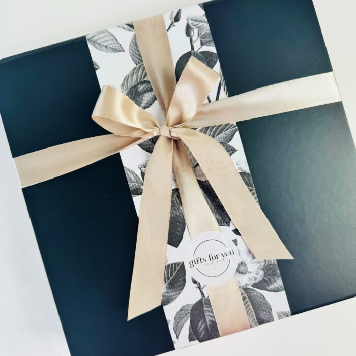 Black gift box with wrap and ribbon.