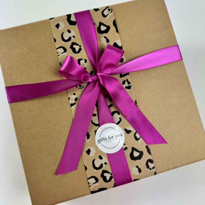 Kraft gift box with wrap and ribbon.