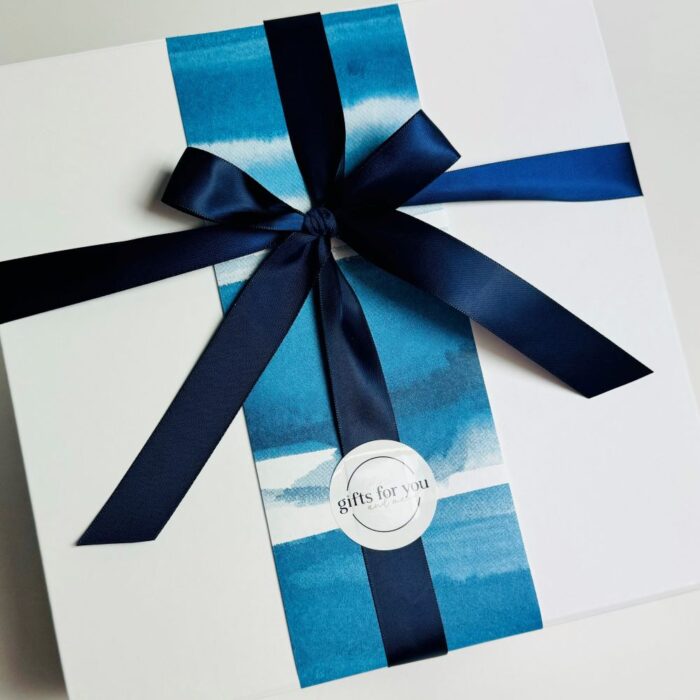 White gift box with wrap and ribbon.